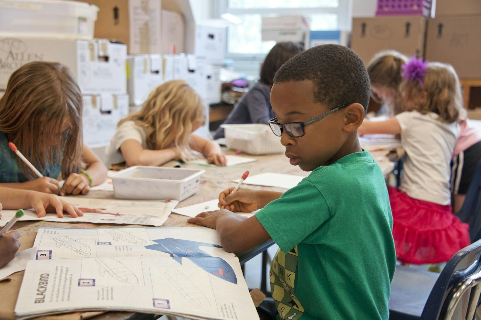 Elementary students at classroom tables